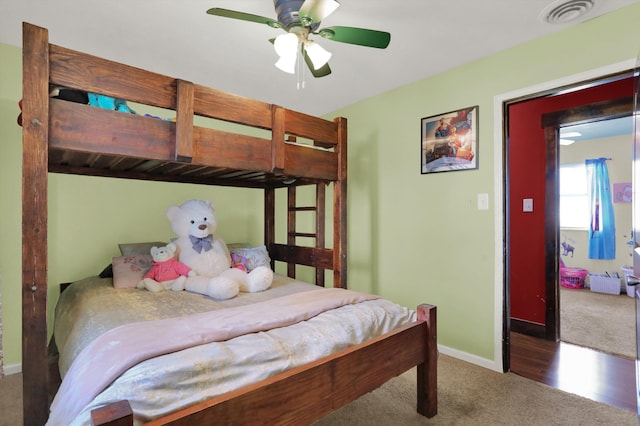 carpeted bedroom featuring ceiling fan