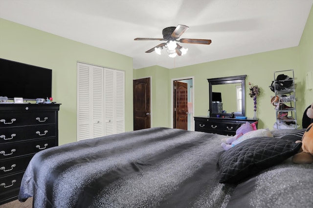 bedroom with carpet floors, a closet, and ceiling fan