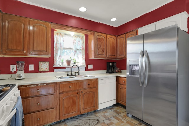 kitchen featuring stove, light tile floors, stainless steel refrigerator with ice dispenser, sink, and white dishwasher