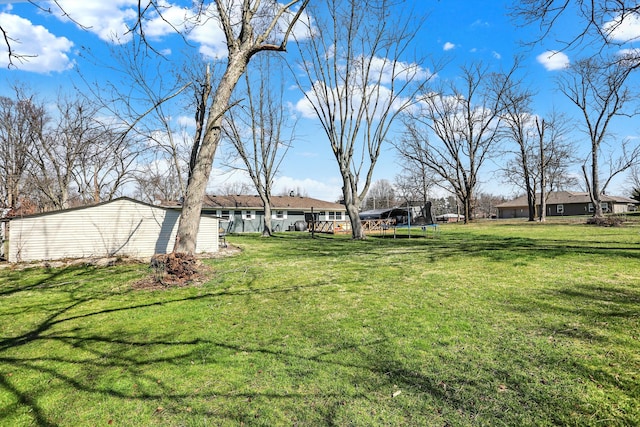 view of yard featuring a trampoline