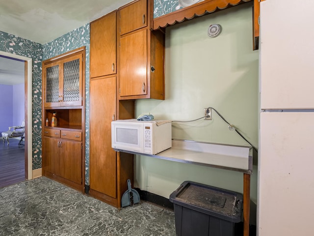 kitchen with white appliances and hardwood / wood-style flooring