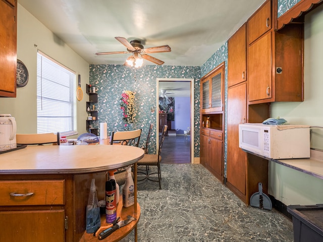 dining area featuring ceiling fan and hardwood / wood-style floors