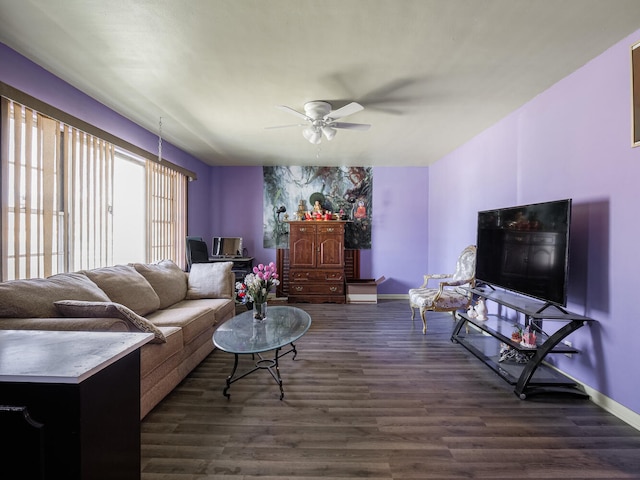 living room featuring dark hardwood / wood-style floors and ceiling fan