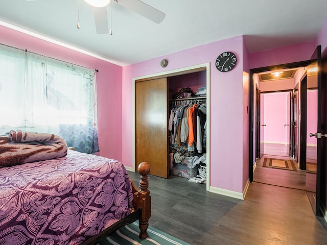 bedroom with a closet, ceiling fan, and dark wood-type flooring