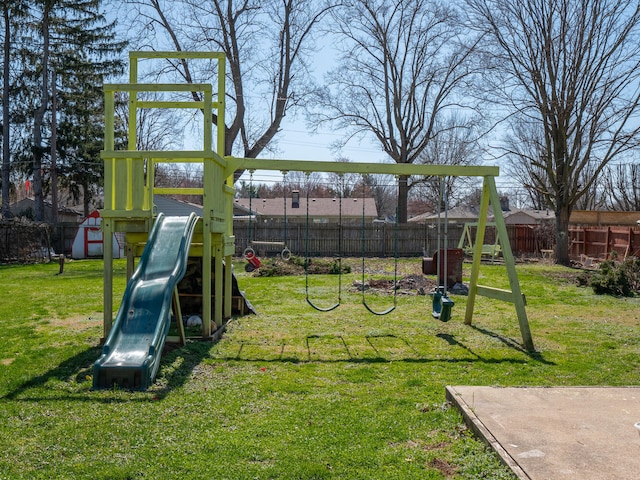 view of playground with a lawn