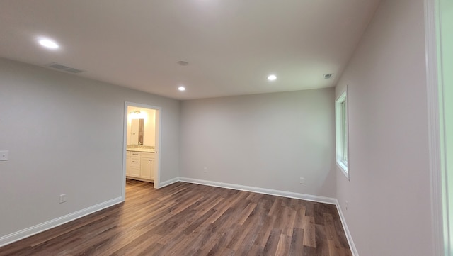 spare room featuring dark hardwood / wood-style floors