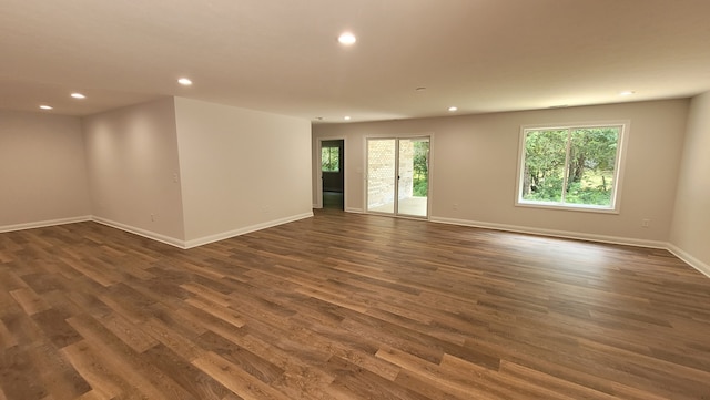 unfurnished room featuring dark hardwood / wood-style flooring