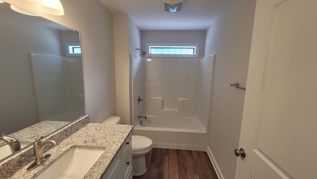 full bathroom featuring shower / washtub combination, toilet, oversized vanity, and wood-type flooring