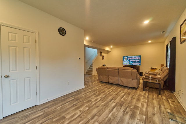 living room with dark hardwood / wood-style flooring