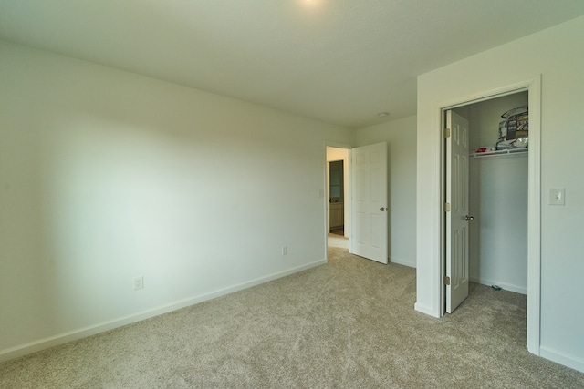 unfurnished bedroom with light colored carpet