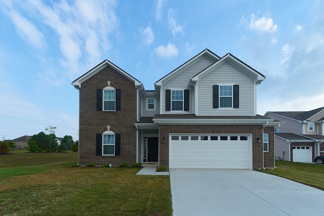 view of property with a front lawn and a garage