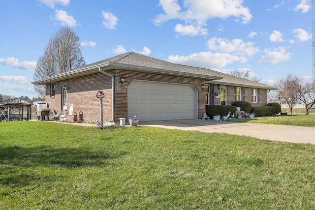 ranch-style house featuring a front yard and a garage