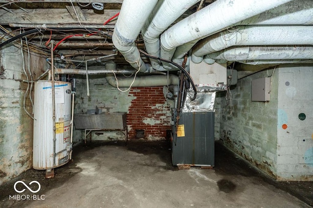 basement with gas water heater, sink, heating unit, and electric panel