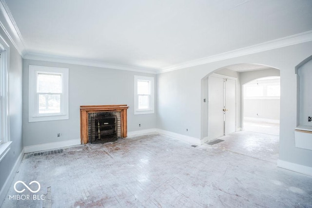 unfurnished living room featuring ornamental molding