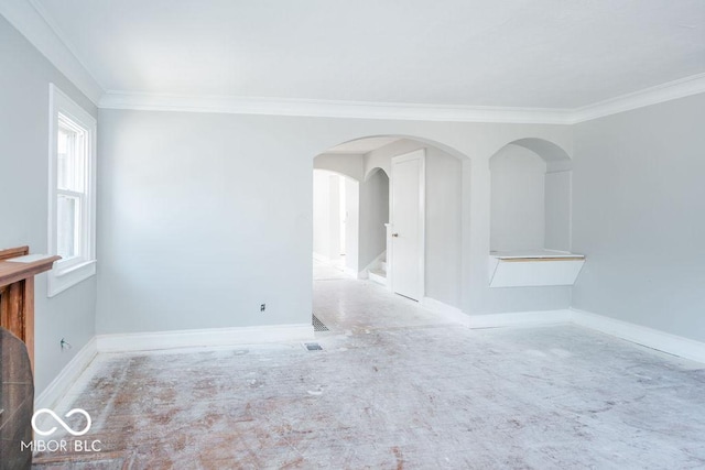 spare room featuring crown molding