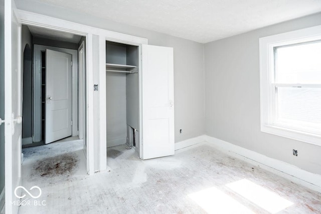 unfurnished bedroom with a closet