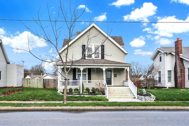 view of front of house with a front lawn and covered porch