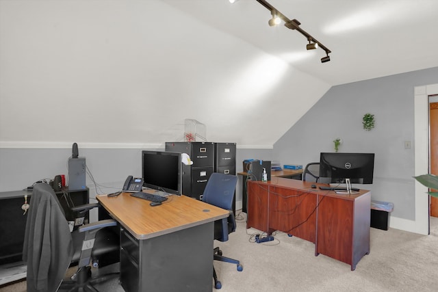 home office featuring lofted ceiling, light colored carpet, and track lighting