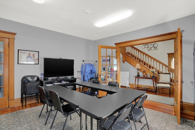 office featuring radiator and hardwood / wood-style flooring