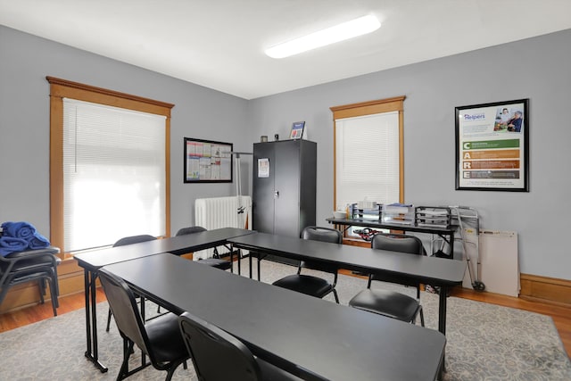 office space with wood-type flooring