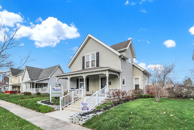 view of front of property featuring a porch and a front yard