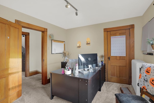 office with track lighting and light colored carpet