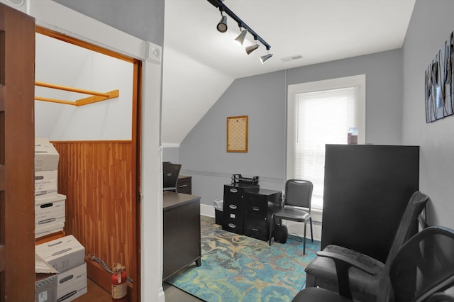 office area featuring rail lighting and vaulted ceiling