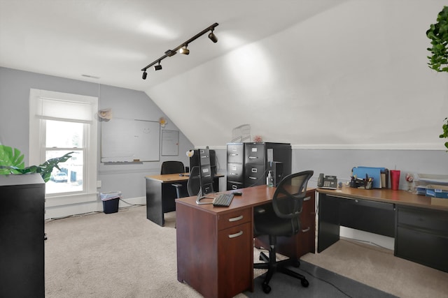 office area with lofted ceiling, track lighting, and light colored carpet