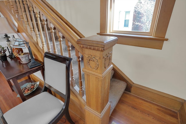 stairs featuring wood-type flooring