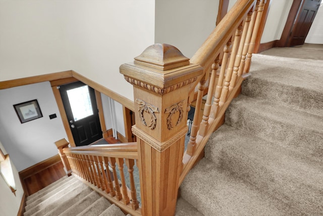 staircase with light carpet