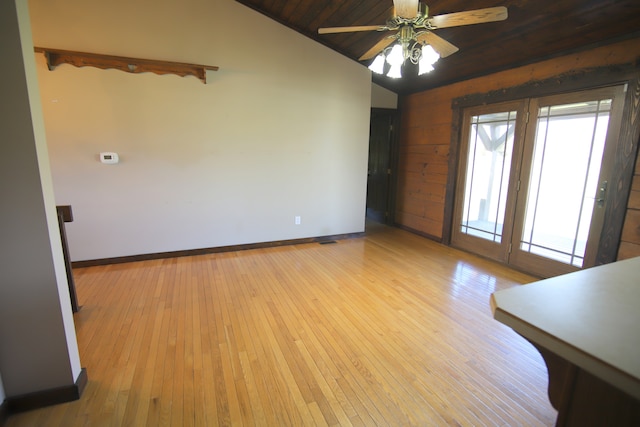 unfurnished room with ceiling fan, light wood-type flooring, wood ceiling, and vaulted ceiling