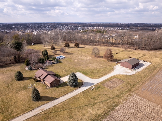 birds eye view of property with a rural view