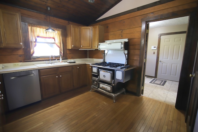 kitchen with dishwasher, lofted ceiling, light hardwood / wood-style flooring, and pendant lighting