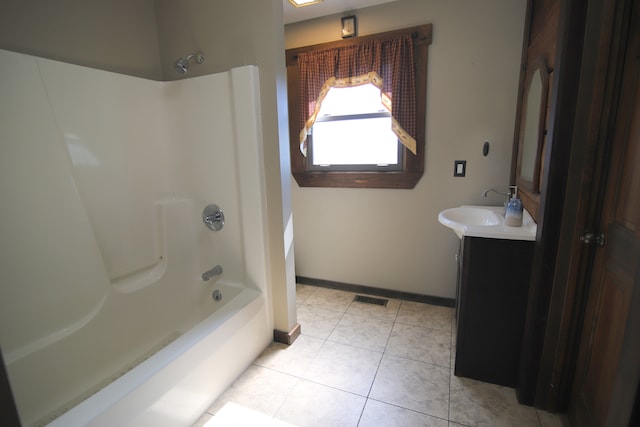 bathroom with tile flooring, bathtub / shower combination, and vanity