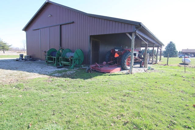 view of shed / structure featuring a yard and a garage