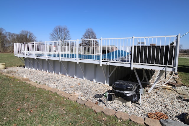 exterior space with a wooden deck and a yard