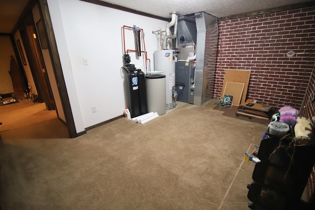 basement with carpet flooring, a textured ceiling, brick wall, and water heater