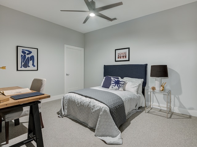 bedroom featuring ceiling fan and light colored carpet