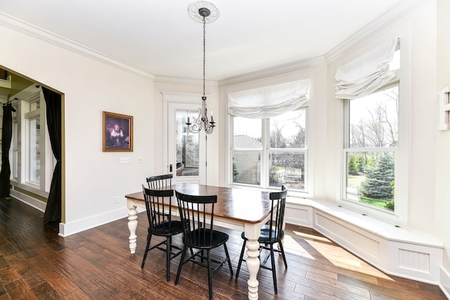 dining space featuring a chandelier, crown molding, and dark hardwood / wood-style flooring