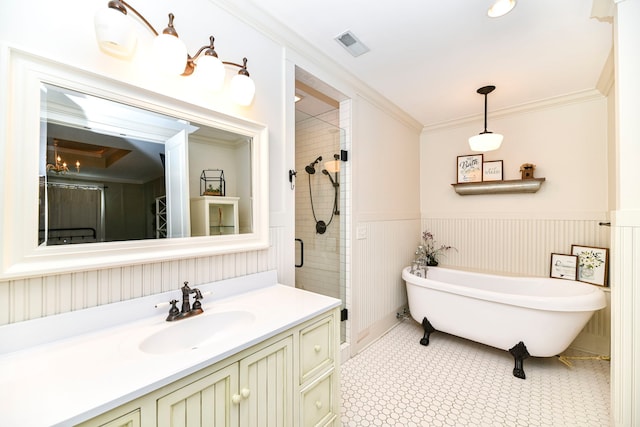 bathroom with vanity, tile floors, a shower with shower door, and ornamental molding