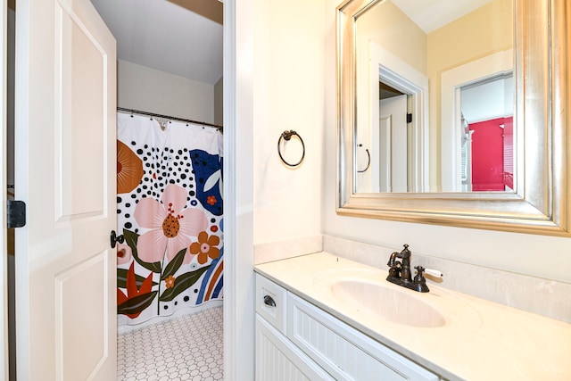 bathroom with vanity and tile floors