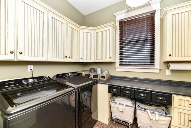 laundry room with carpet floors, cabinets, and washing machine and dryer