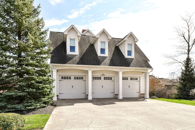 cape cod-style house featuring a garage