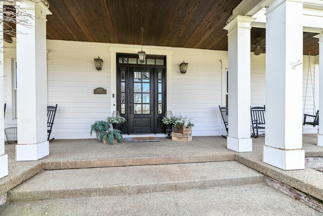 property entrance featuring a porch