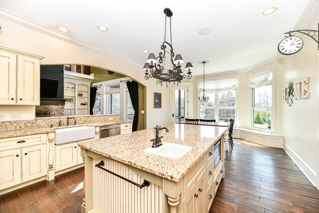 kitchen with decorative light fixtures, a chandelier, dark hardwood / wood-style flooring, and sink