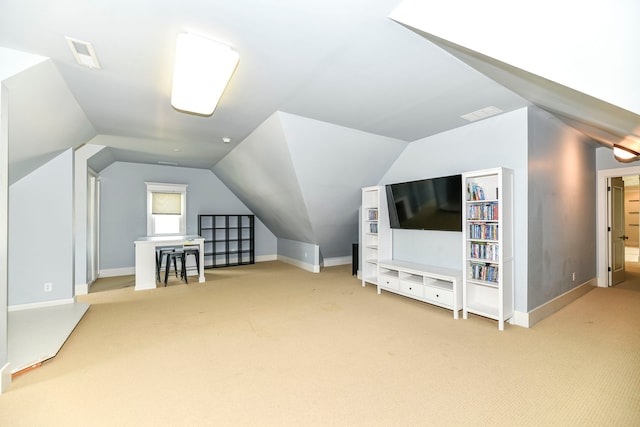 bonus room featuring light colored carpet and vaulted ceiling