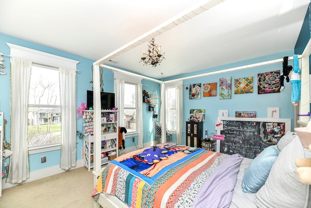 bedroom featuring light carpet