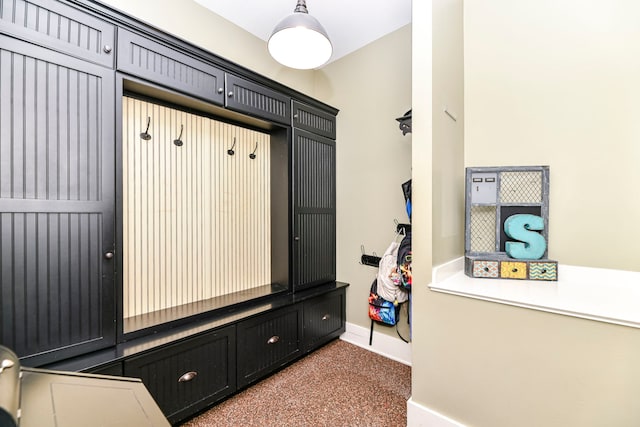 mudroom featuring dark carpet