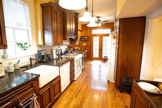 kitchen with ceiling fan, french doors, light hardwood / wood-style flooring, white appliances, and sink