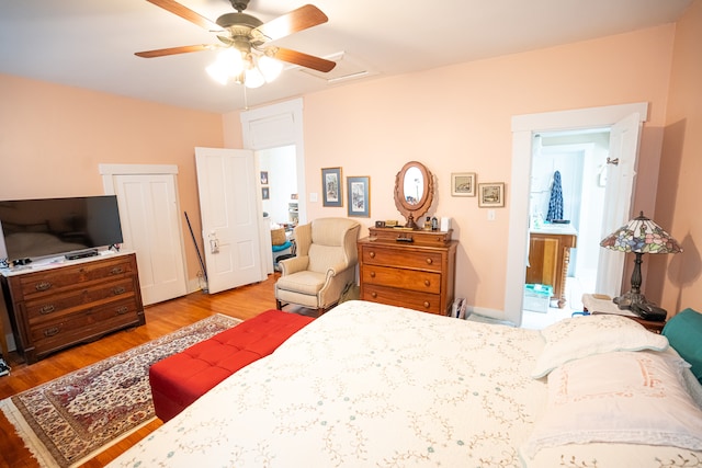 bedroom with ceiling fan and light hardwood / wood-style floors